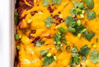 Creamy Chicken Enchiladas with Melted Cheese and Green Sauce