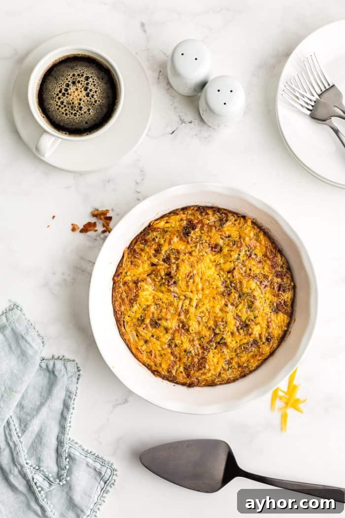 overhead view of baked keto quiche next to a cup of black coffee