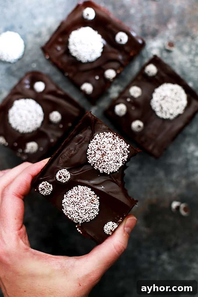 These Sno-Cap Chocolate Ganache Brownies are decadence at it's finest, my friends.  A fudgy brownie base is studded with Sno-Cap nonpareil candies before being flooded with thick layer of chocolate ganache and adorned with additional candy.