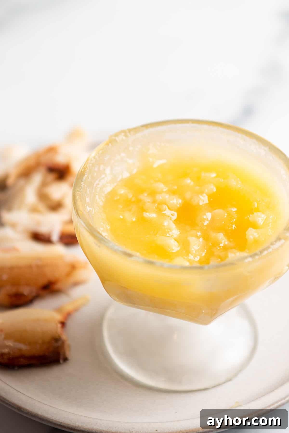 Garlic Butter Sauce Recipe for Seafood and Shellfish 5 A small plate with fresh crab meat and a dish of garlic butter.