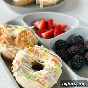 Moist Baked Carrot Cake Donuts with Cream Cheese Glaze 13 Baked carrot cake donuts served with berries.