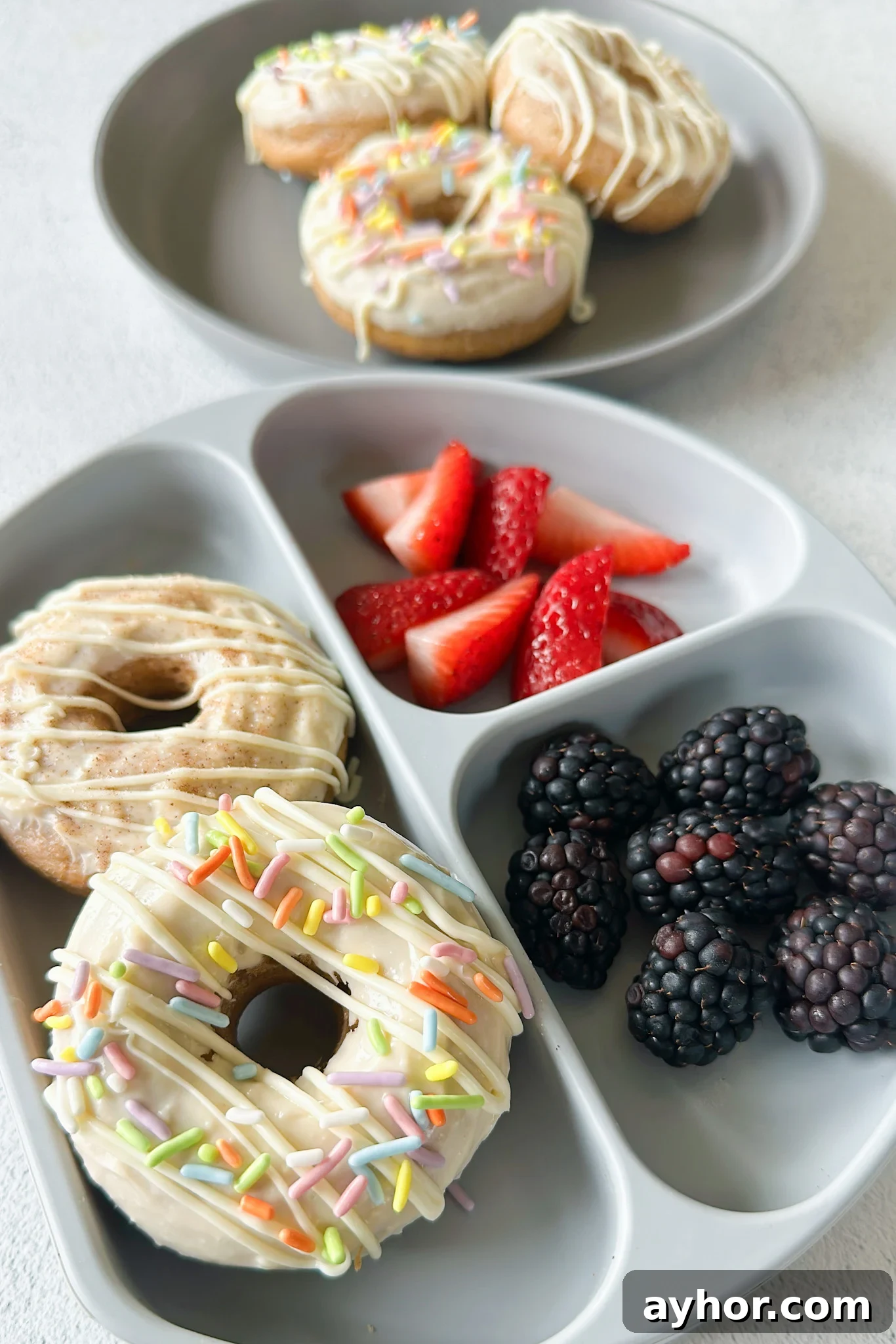 Moist Baked Carrot Cake Donuts with Cream Cheese Glaze 8 Baked carrot cake donuts served with berries.