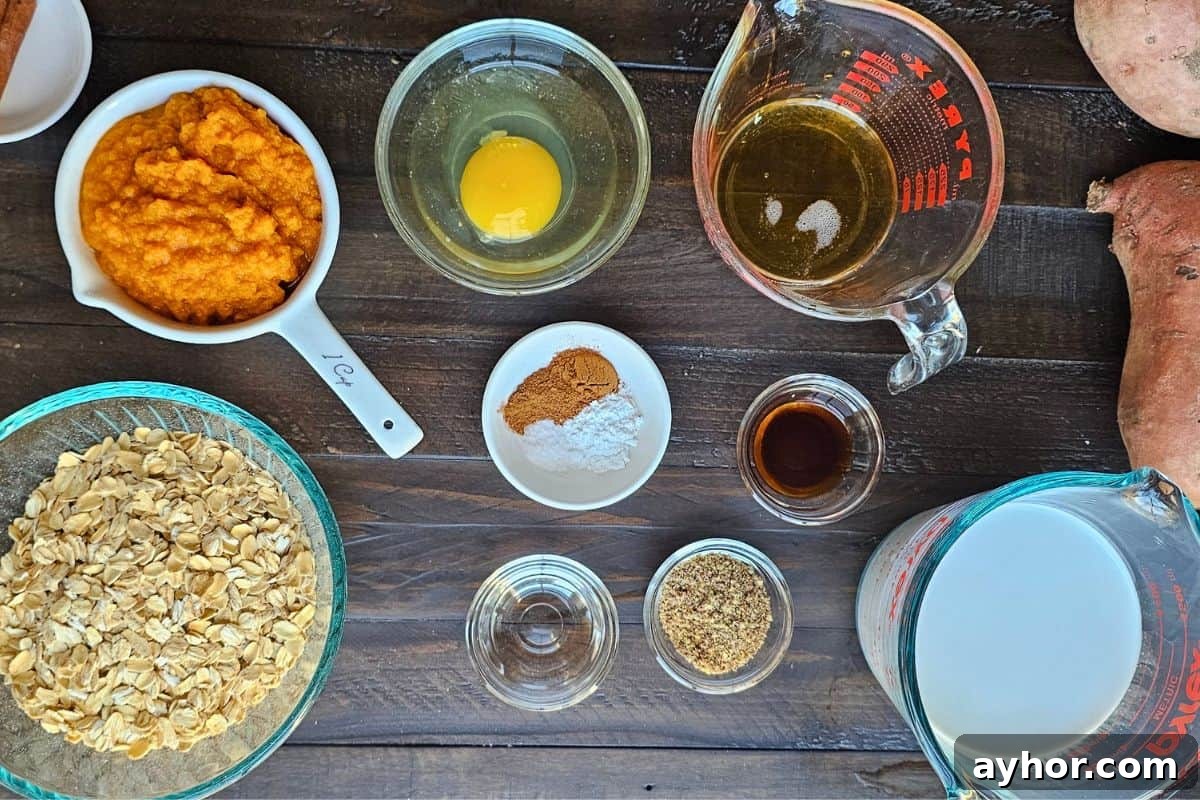 Creamy Sweet Potato Oatmeal Recipe for Breakfast and Meal Prep 2 Oats, maple syrup, milk, egg, flax, spices, and sweet potato puree on counter to make sweet potato oatmeal.