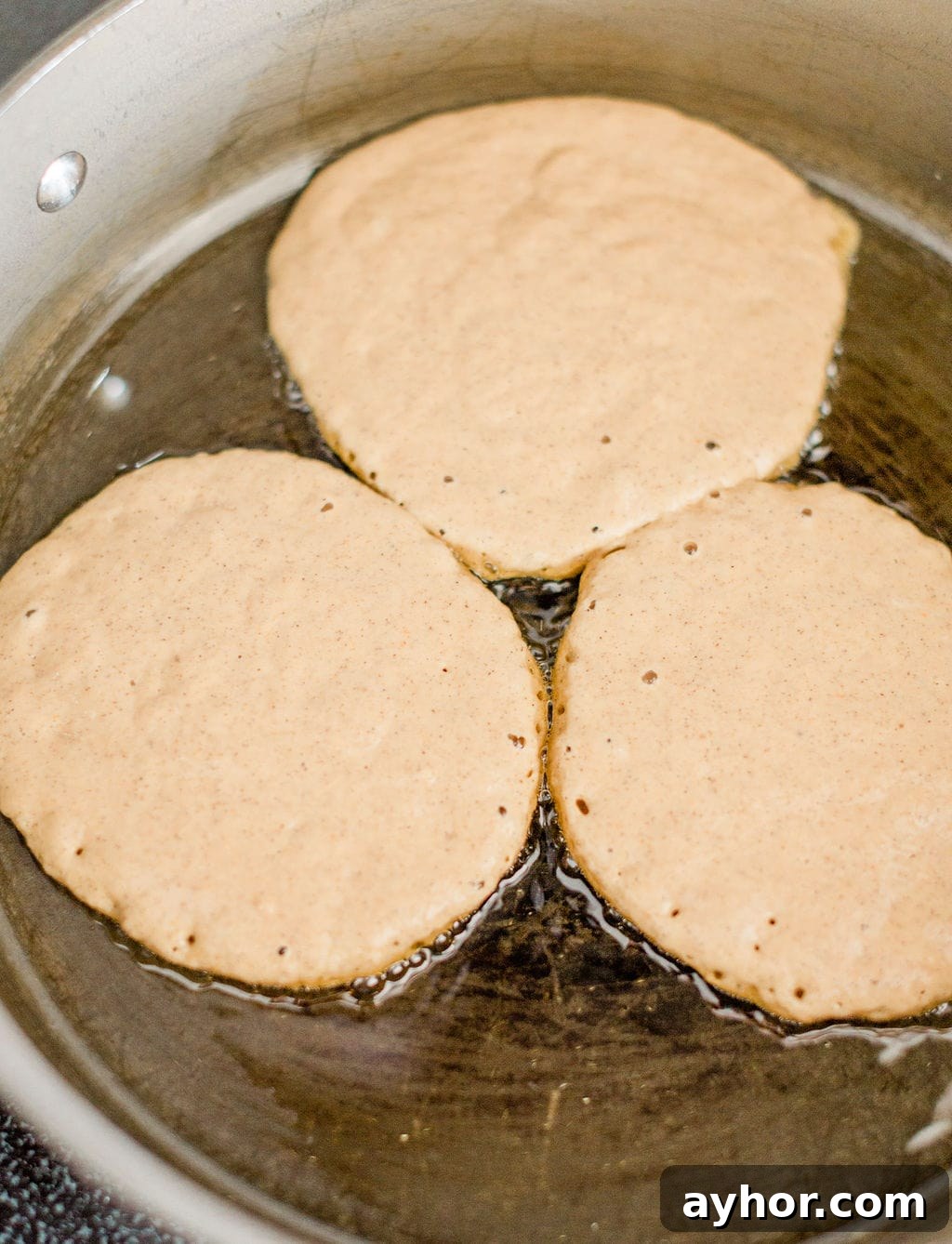 spooning batter onto skillet