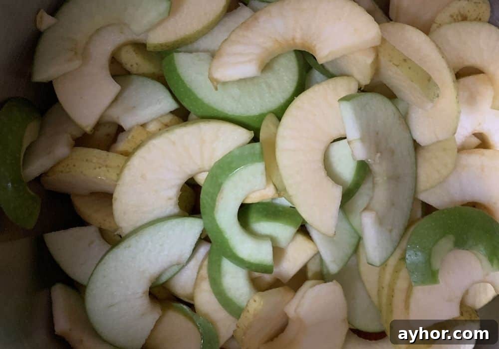Instant Pot Cinnamon Apples: Quick Spiced Apple Dessert 7 Apple slices for making cinnamon apples in the Instant Pot