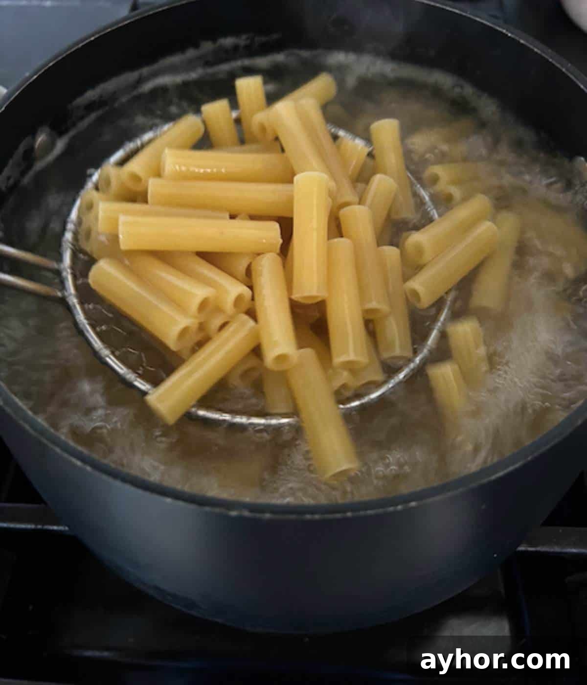 Vegetarian Baked Ziti with Cheesy Tomato Sauce 4 Ziti cooking in boiling water.