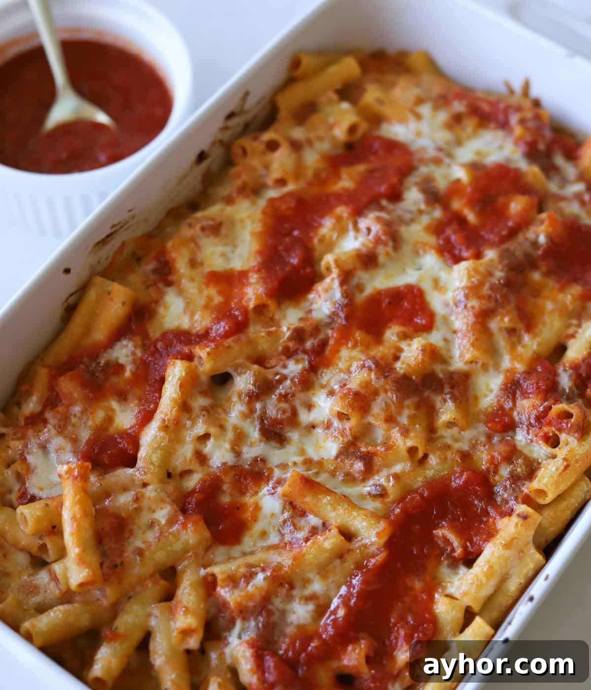 Vegetarian Baked Ziti with Cheesy Tomato Sauce 10 Meatless baked ziti in casserole dish with sauce on side.