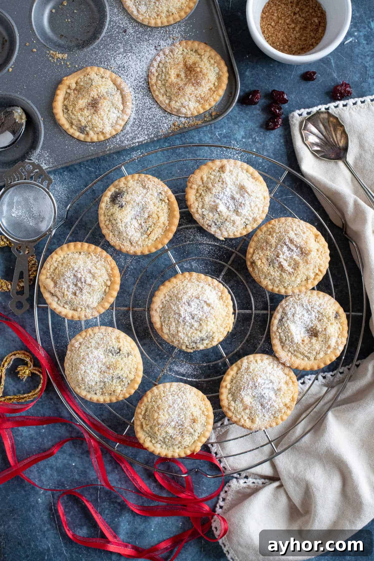 Crumble-Topped Mince Pies Recipe for Festive Holidays 7 Crumble topped mince pies dusted with icing sugar.