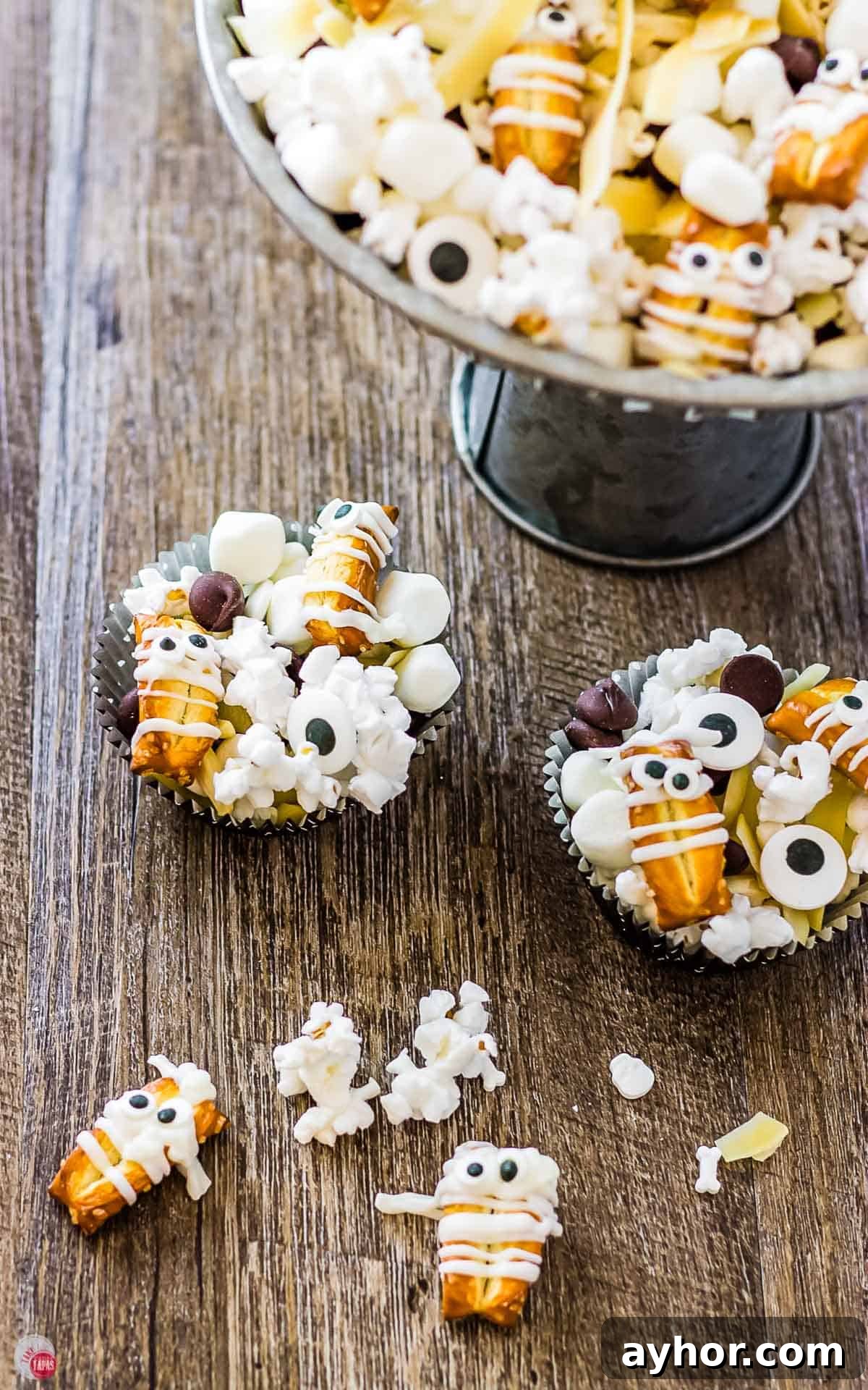 Mummy Munch: Delicious Snacks for Expecting Moms 2 two cupcake liners filled with snack mix