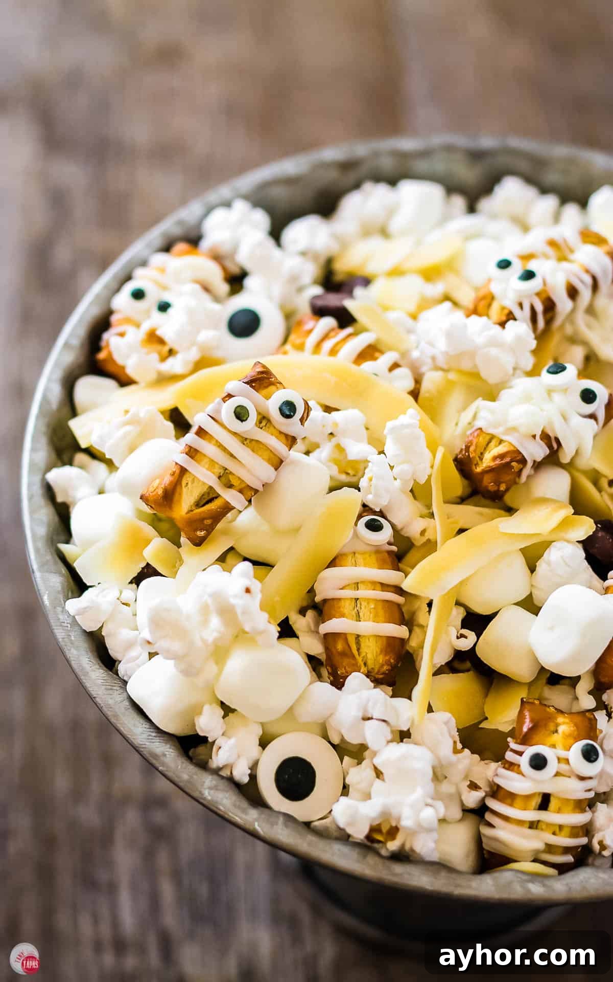 Mummy Munch: Delicious Snacks for Expecting Moms 3 overhead picture of grey cake plate filled with halloween mummy mix