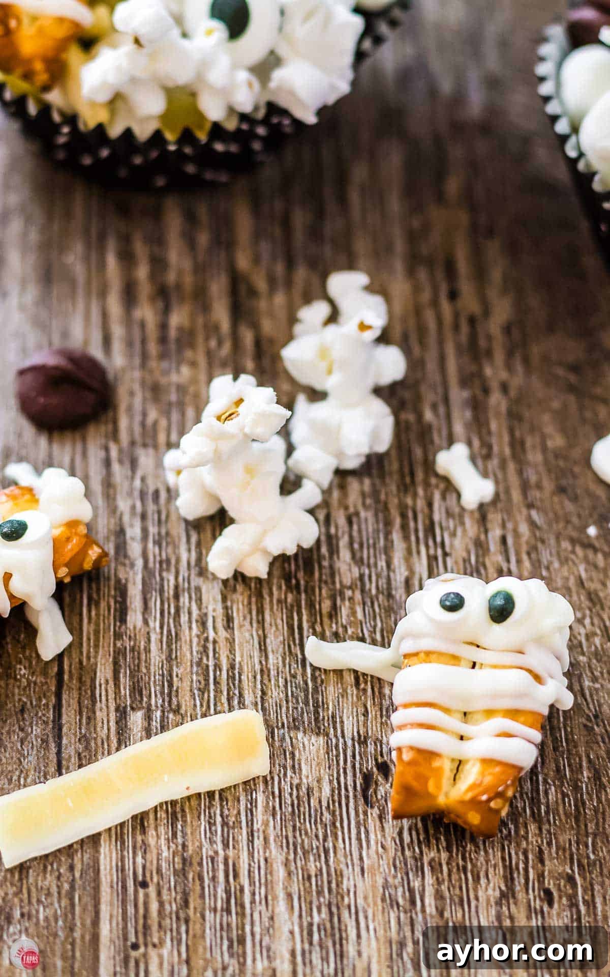 Mummy Munch: Delicious Snacks for Expecting Moms 4 close up of pretzel with white chocolate drizzle with eyes