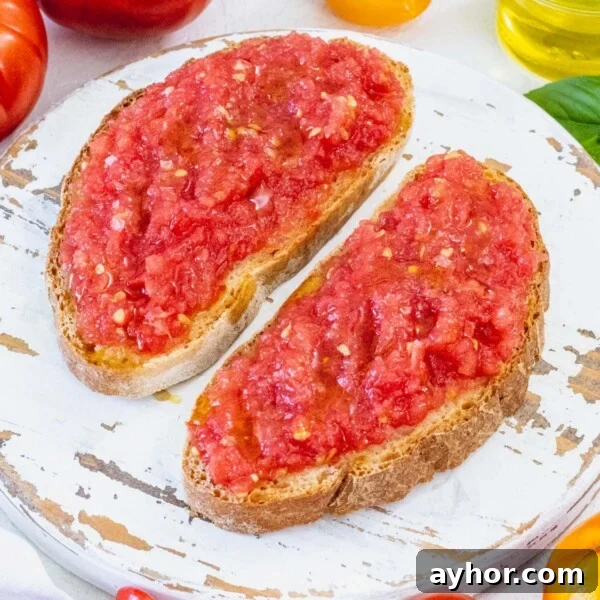 Pan con tomate on a white platter