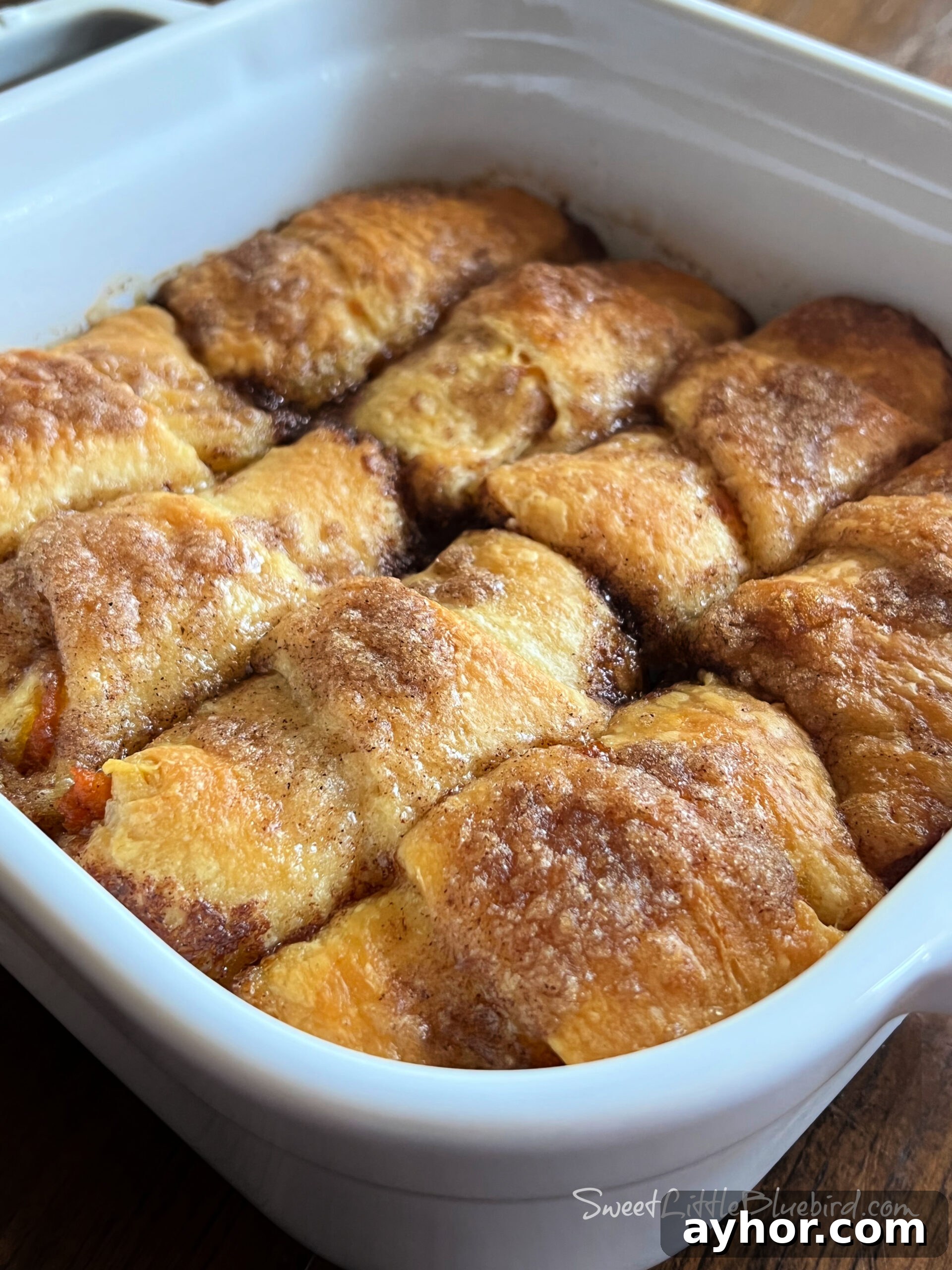 This is a photo of the Pumpkin Dumplings after baking in a white square baking dish. 
