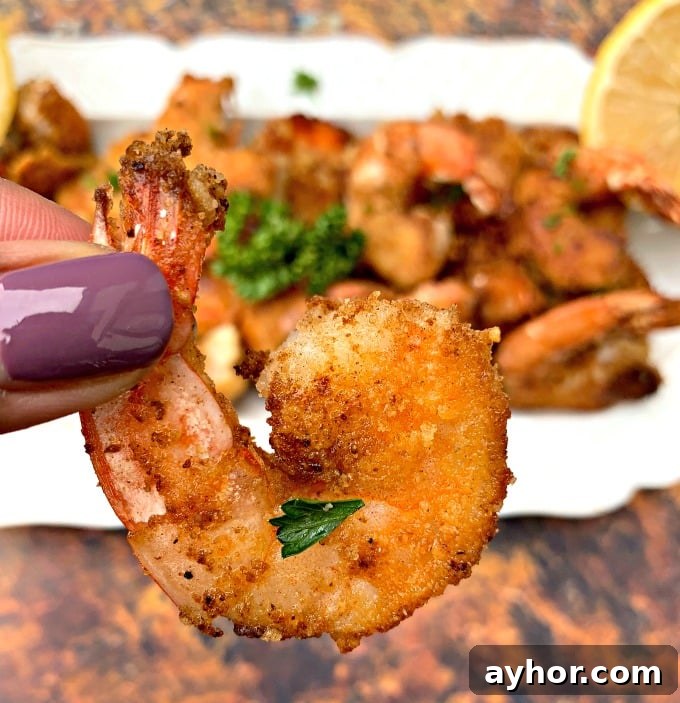person holding keto low carb breaded shrimp