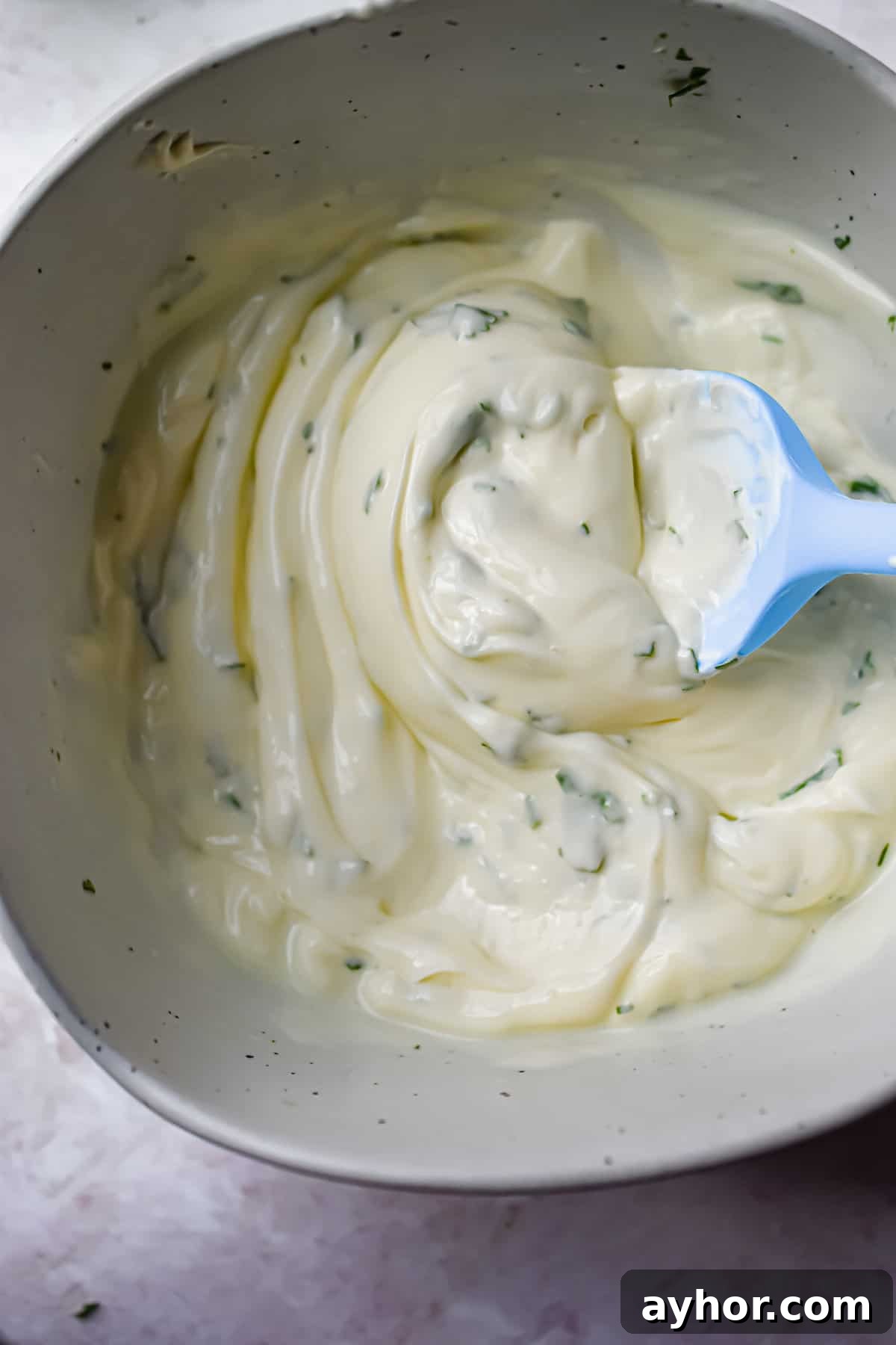 A spoon is mixing the ingredients together.