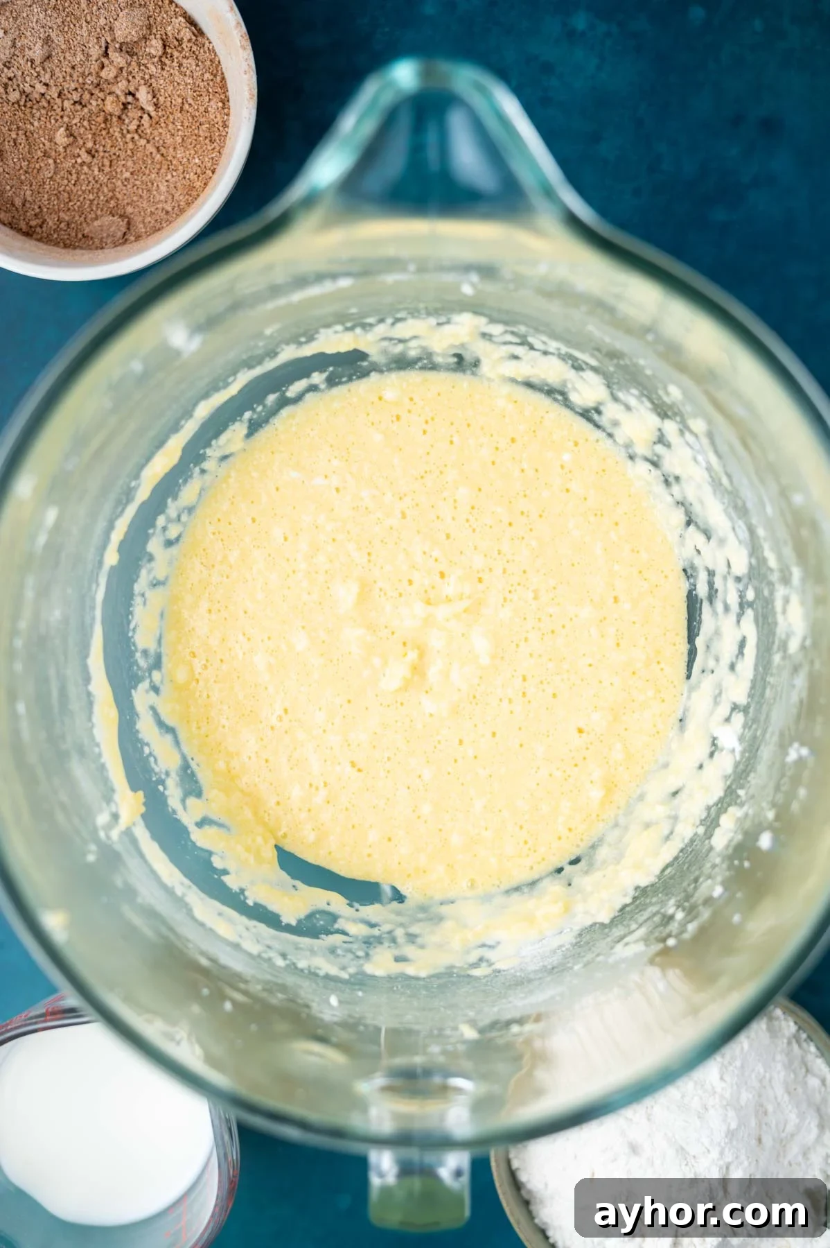 cake batter after eggs and sour cream have been mixed into the butter and sugar