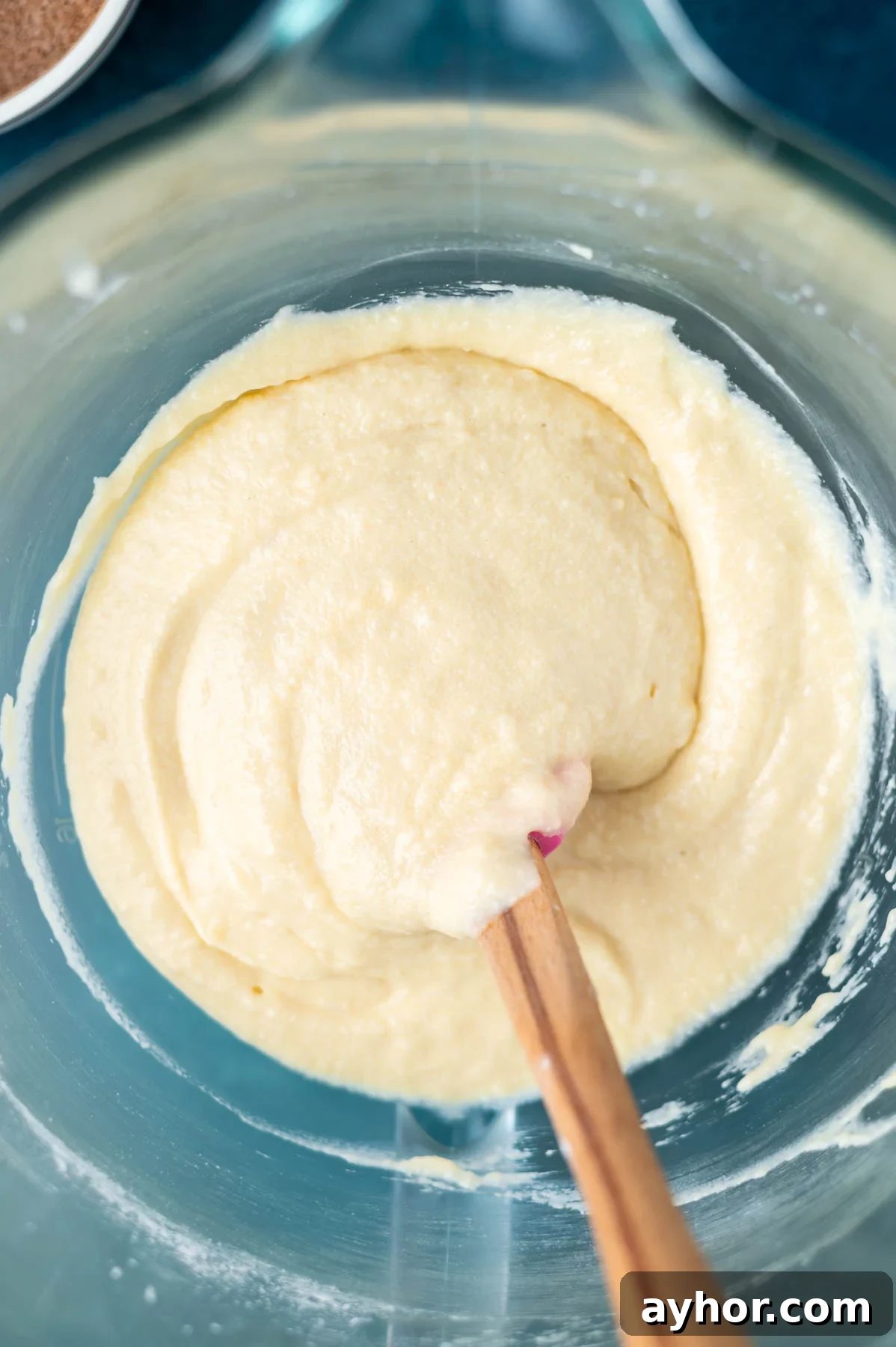 cake batter in a bowl with a spatula