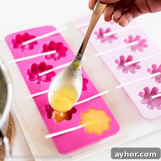 Orange Creamsicle Fudge Recipe: Tangy Orange Vanilla Fudge 15 Spooning the mixture into silicone lollipop molds | Low-Carb, So Simple