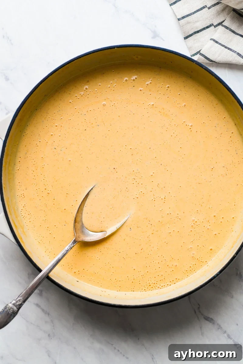cajun cheese sauce in a skillet