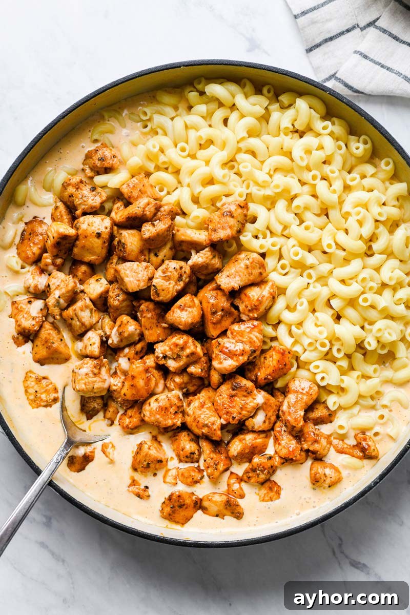 canjun chicken and macaroni added to the skillet