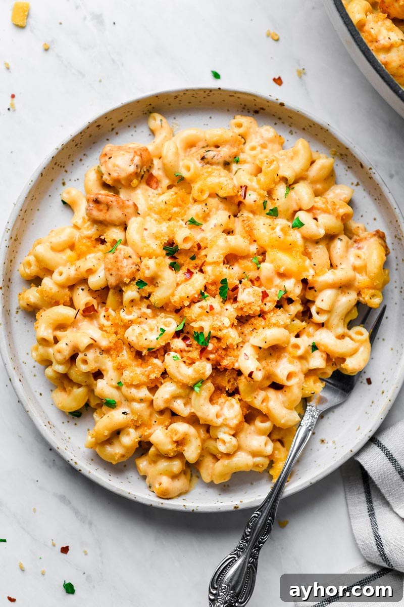 chicken mac and cheese served on a plate