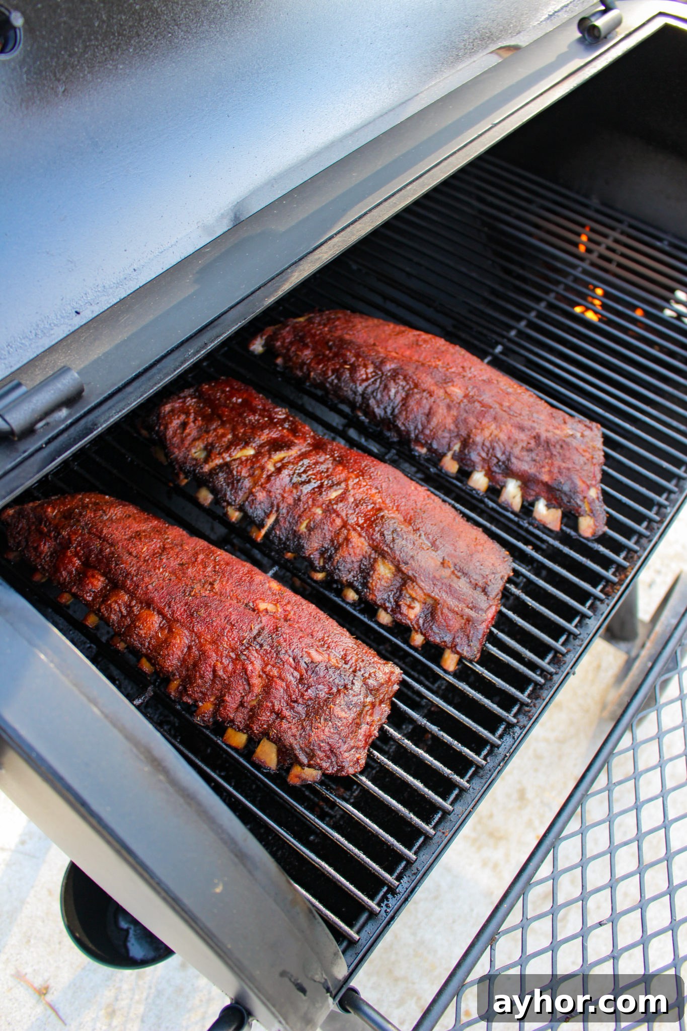 Maple-Cajun Smoked Ribs Recipe for Tender, Flavorful BBQ 3 Maple Cajun Smoked Ribs sitting on the smoker.