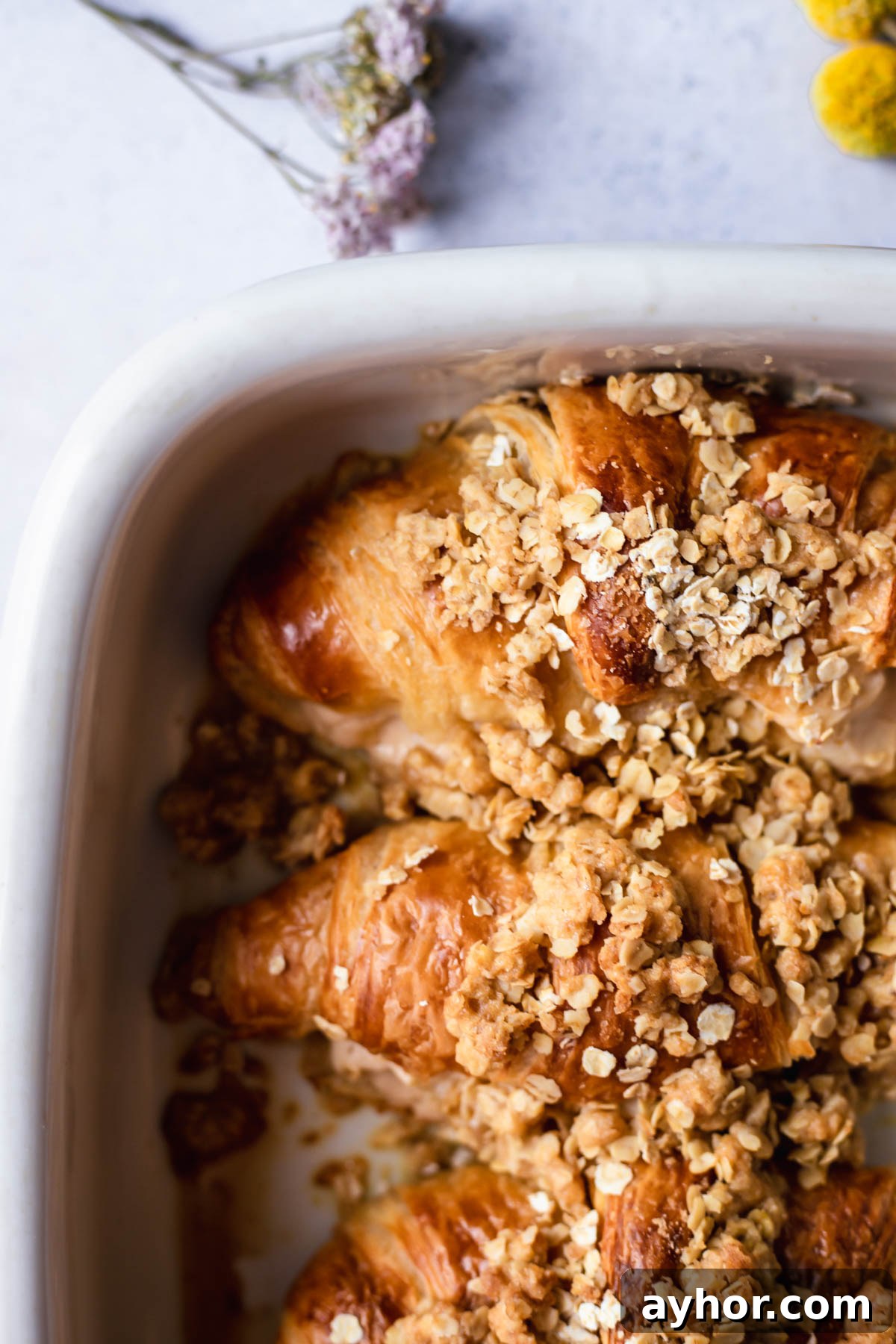 Cinnamon Apple French Toast Bake with Crisp Topping 8 baking dish full of cinnamon crisp apple french toast bake croissants