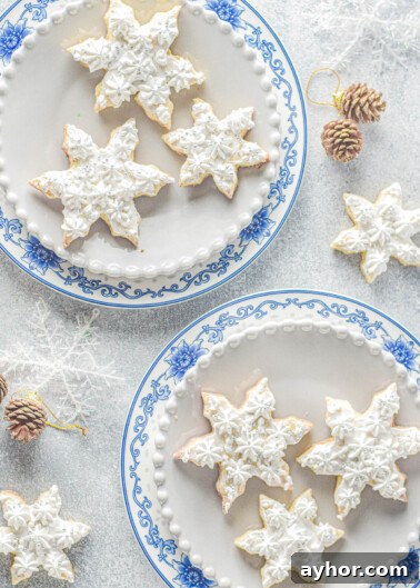 Sand Dollar Cookie Recipe: Crisp Shortbread Cookies Shaped Like Sand Dollars 12 Frosted Snowflake Sugar Cookies - classic piped vanilla frosting and sprinkles for festive cookies.