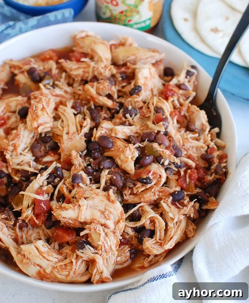 Tender Slow Cooker Shredded Chicken Recipe for Meal Prep 5 Slow Cooker Shredded Chicken with teal napkin