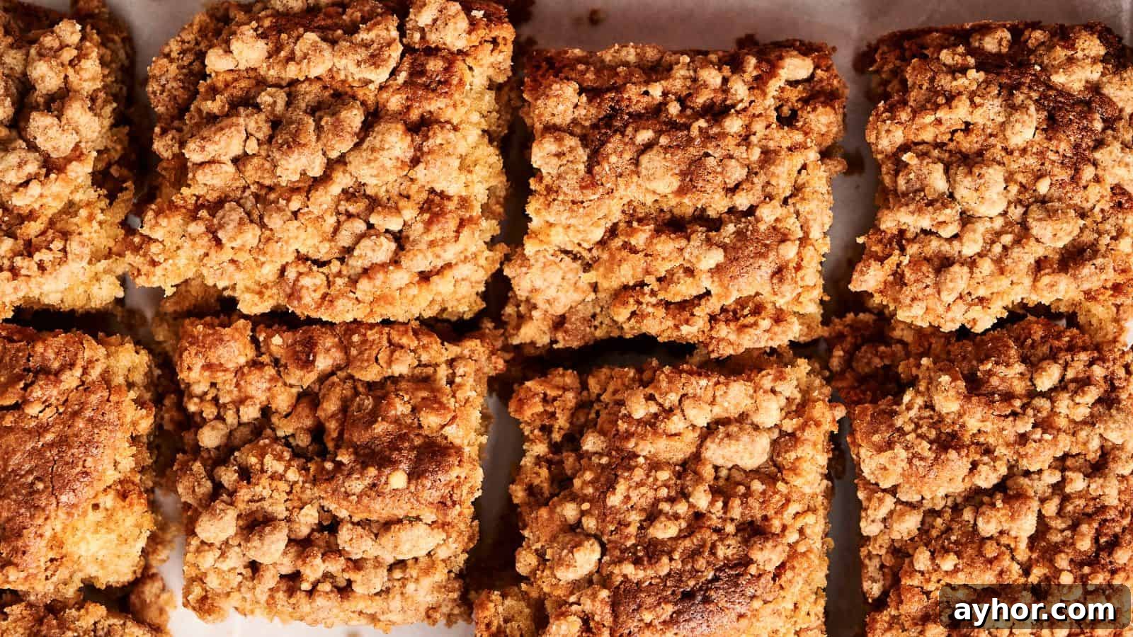 29 Breakfast Recipes to Make Your Mornings Feel Romantic 17 Close-up of eight square pieces of crumb cake with a textured, crumbly topping.