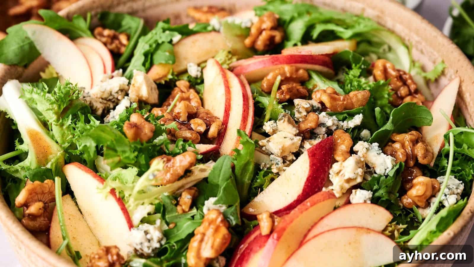 29 Breakfast Recipes to Make Your Mornings Feel Romantic 27 A bowl of mixed greens salad with sliced Honeycrisp apples, walnuts, and crumbled blue cheese.