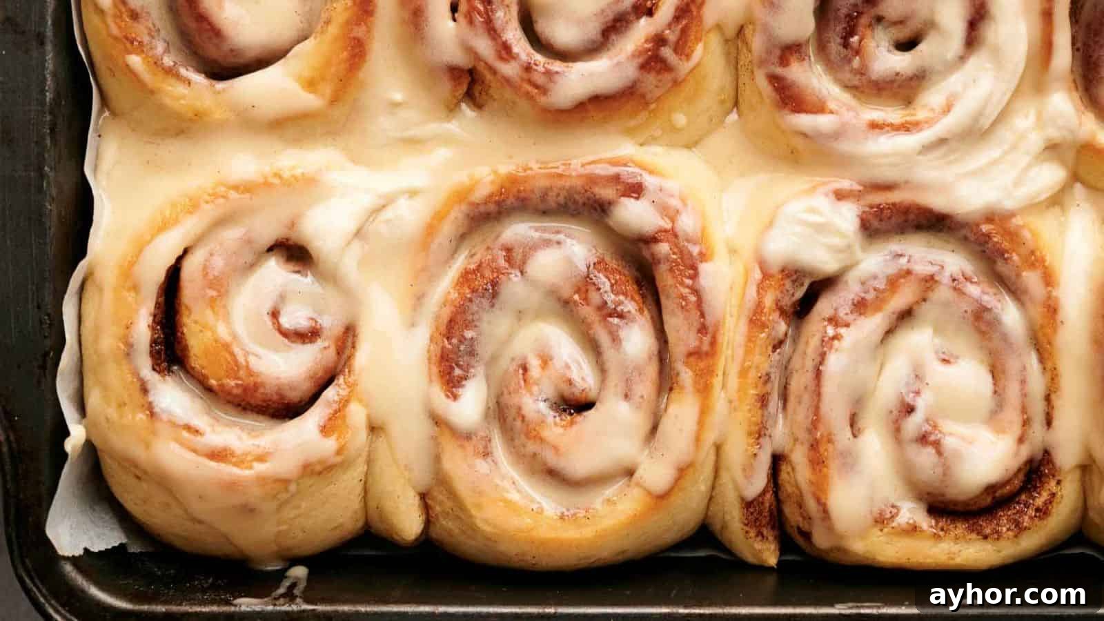 29 Breakfast Recipes to Make Your Mornings Feel Romantic 7 Cinnamon rolls in a pan with icing.