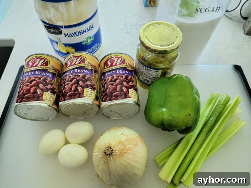 mayo, cans of kidney beans, green pepper, onion, hard boiled eggs, sugar, and celery stalk 