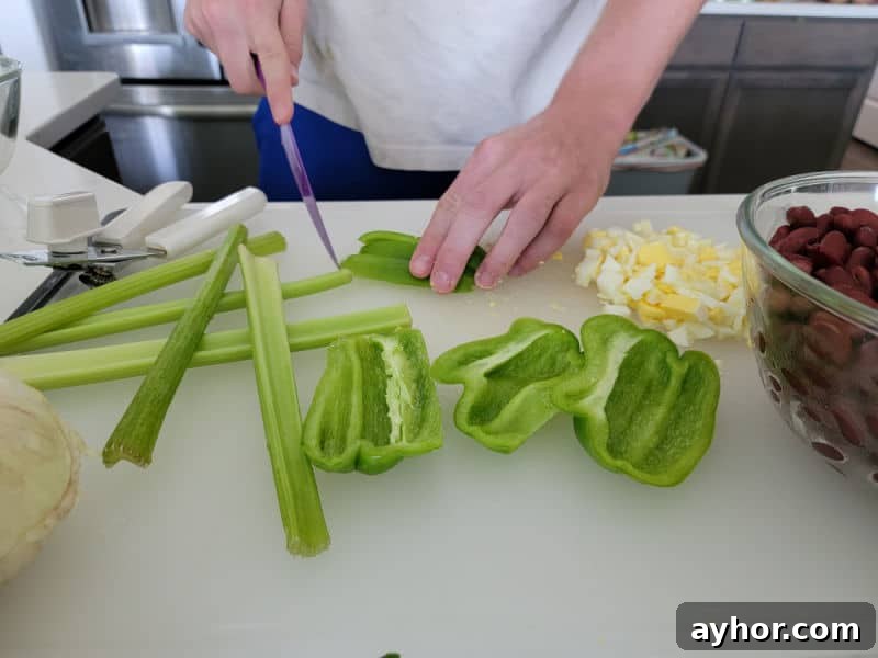 celery stalks and green peppers on a cutting board next to hard boiled eggs