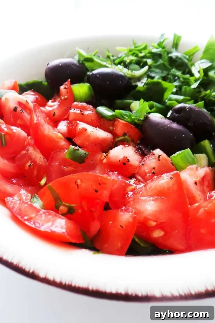 Simple tomato salad recipe! This healthy tomato recipe is delicious, easy and very refreshing. This simple healthy salad is a perfect side dish for summer!