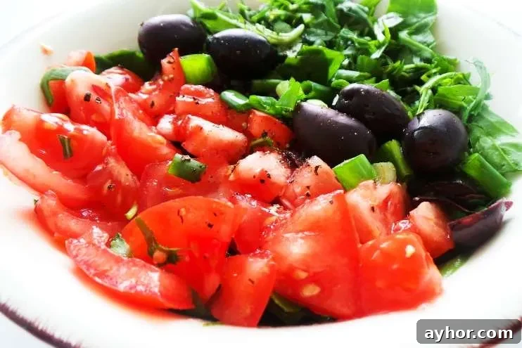 Simple tomato salad recipe! This healthy tomato recipe is delicious, easy and very refreshing. This simple healthy salad is a perfect side dish for summer!