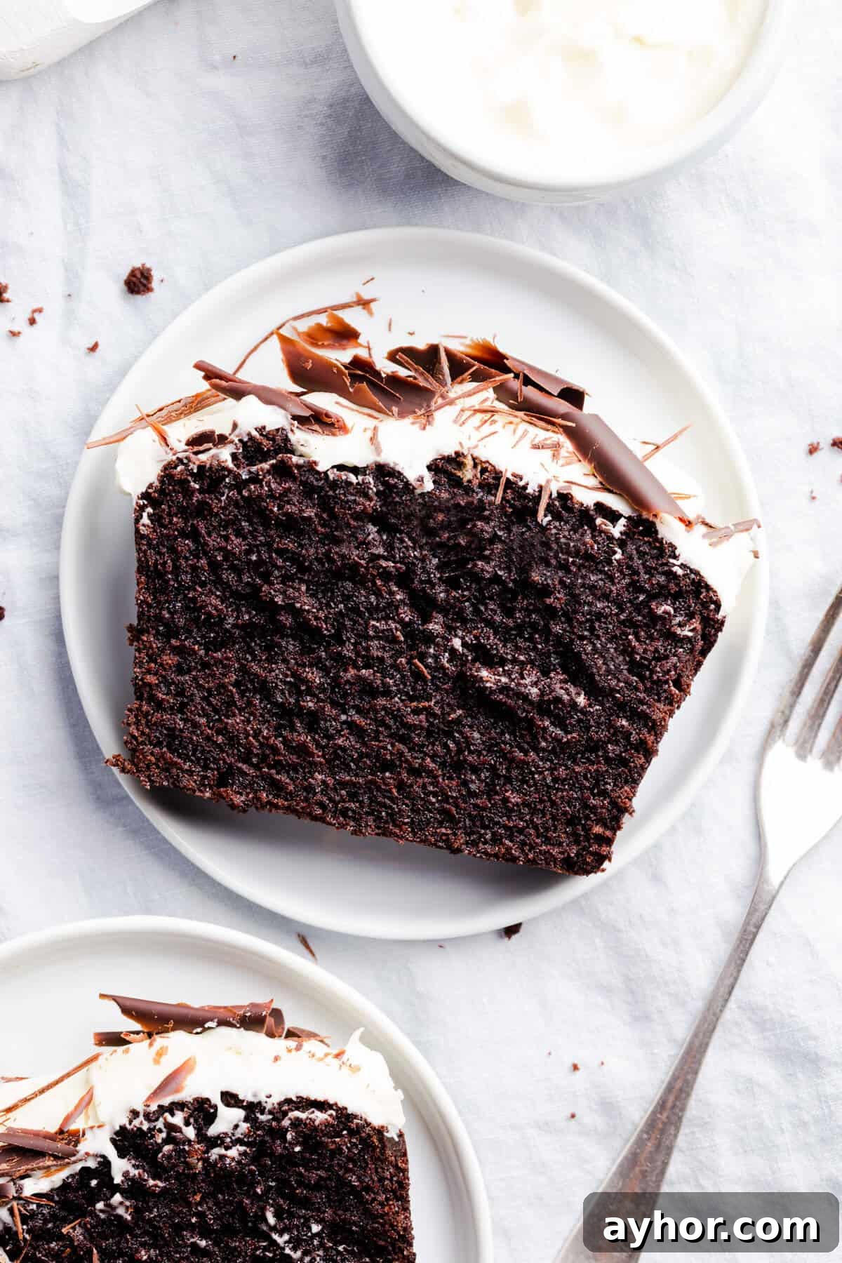 top view close up photo of individual slice of Guinness chocolate loaf cake on a small white plate