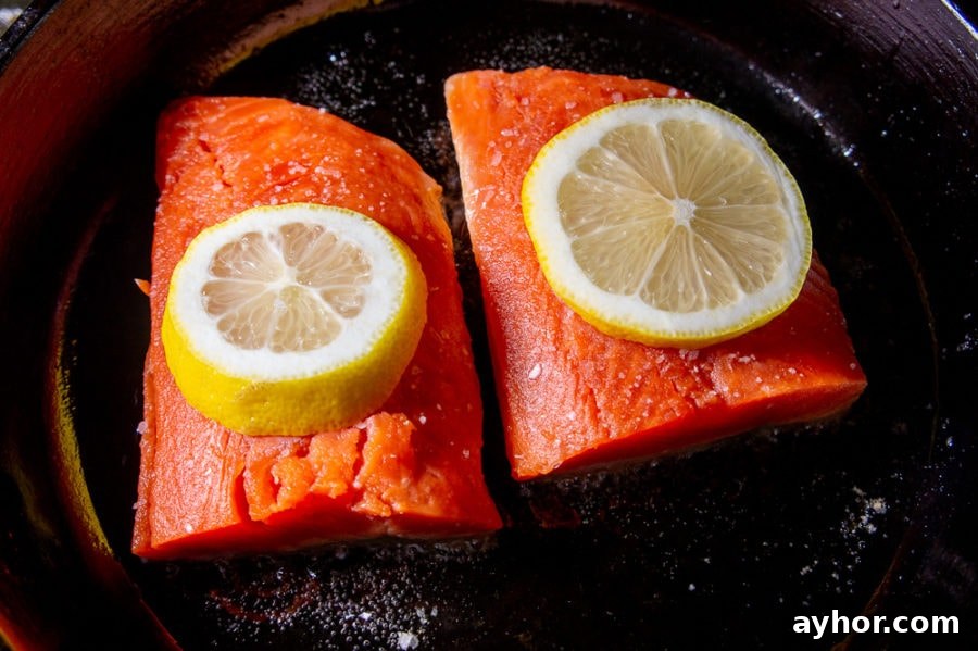 Pan-Seared Salmon in a Cast-Iron Skillet: Crispy Skin, Tender Flesh 3 two salmon filets in a cast iron pan