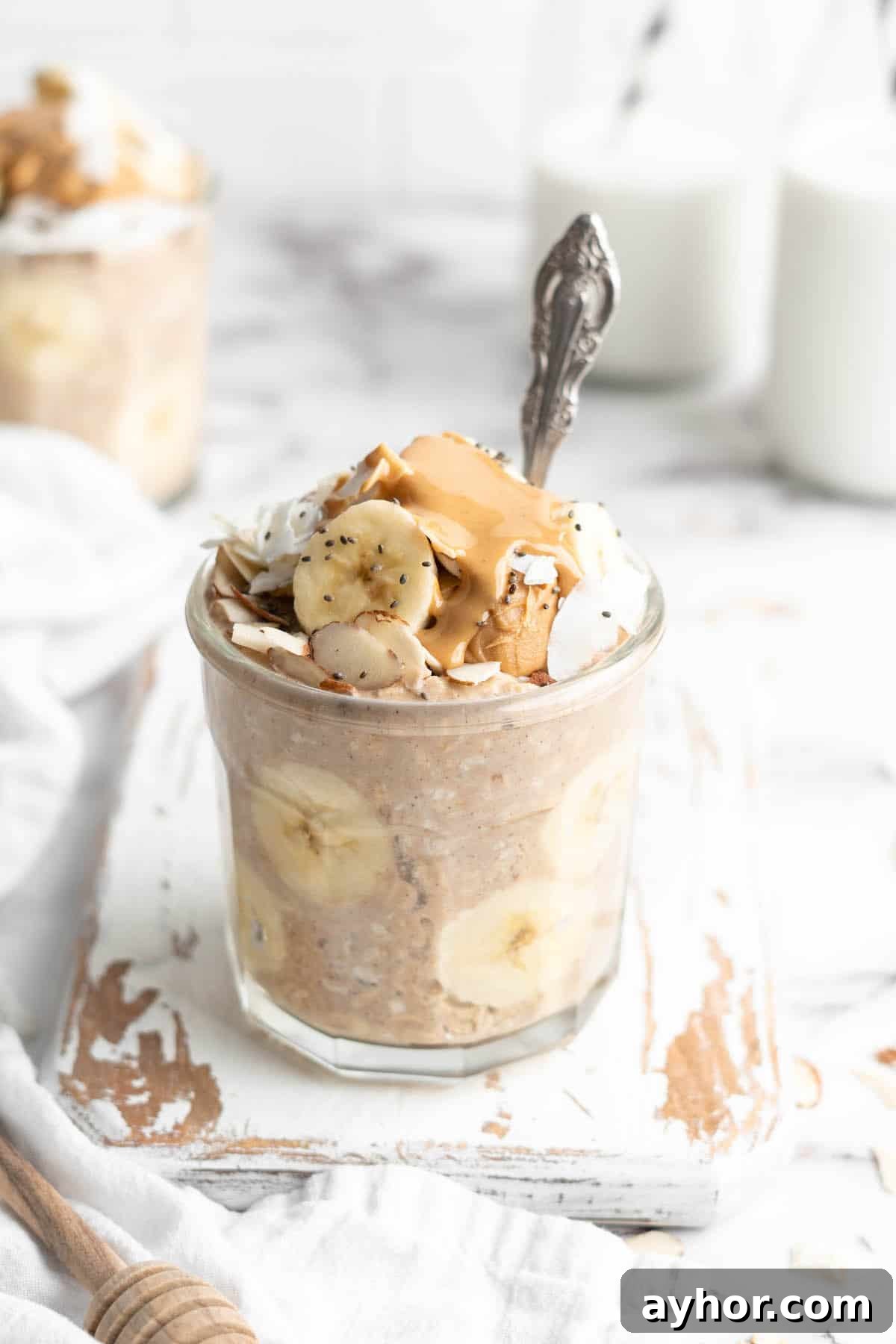 Peanut butter banana overnight oats in jar with spoon