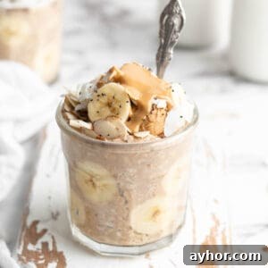 Peanut butter banana overnight oats in jar with spoon