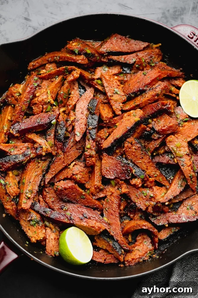 Vegan Carne Asada Recipe: Flavorful Plant-Based Grilled Steak 2 cast iron pan full of mock seitan meat that looks seasoned