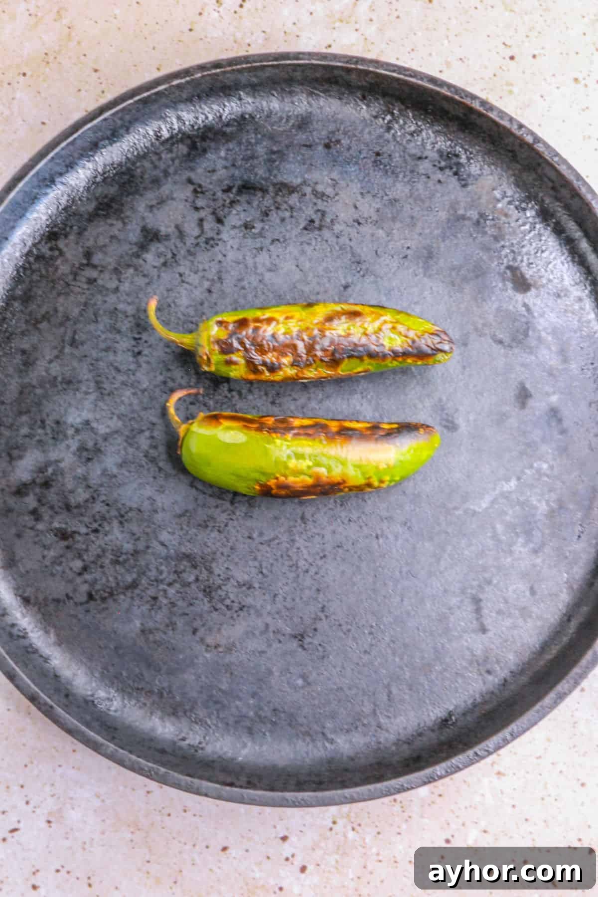 Creamy Jalapeño Ranch Dip Recipe for Parties & Snacks 4 Roasted jalapeños on a comal