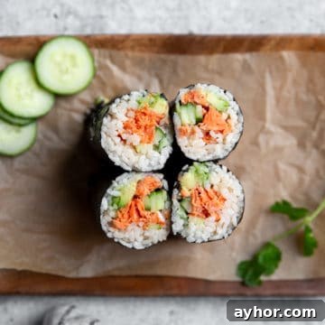 Spicy salmon sushi burritos on a serving platter.