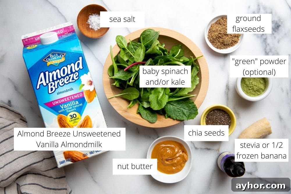 Low-Sugar Green Smoothie Recipe That Actually Tastes Great 3 All of the ingredients for the smoothie arranged on a marble surface.