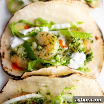 Healthy shrimp tacos on a serving board.