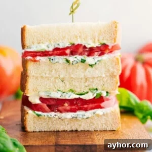 Classic Tomato Sandwich Recipe with Garlic Basil Mayo 3 Tomato Sandwich stacked on top of each other showing the delicious inside.