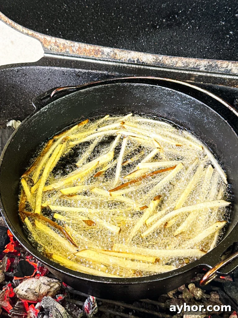 frying fries in a cast iron skillet