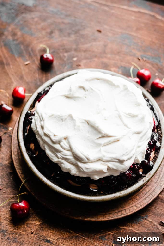No-Bake Black Forest Chocolate Cherry Pie Recipe 7 Black Forest Pie topped with swoops of whipped cream, but not decorated yet