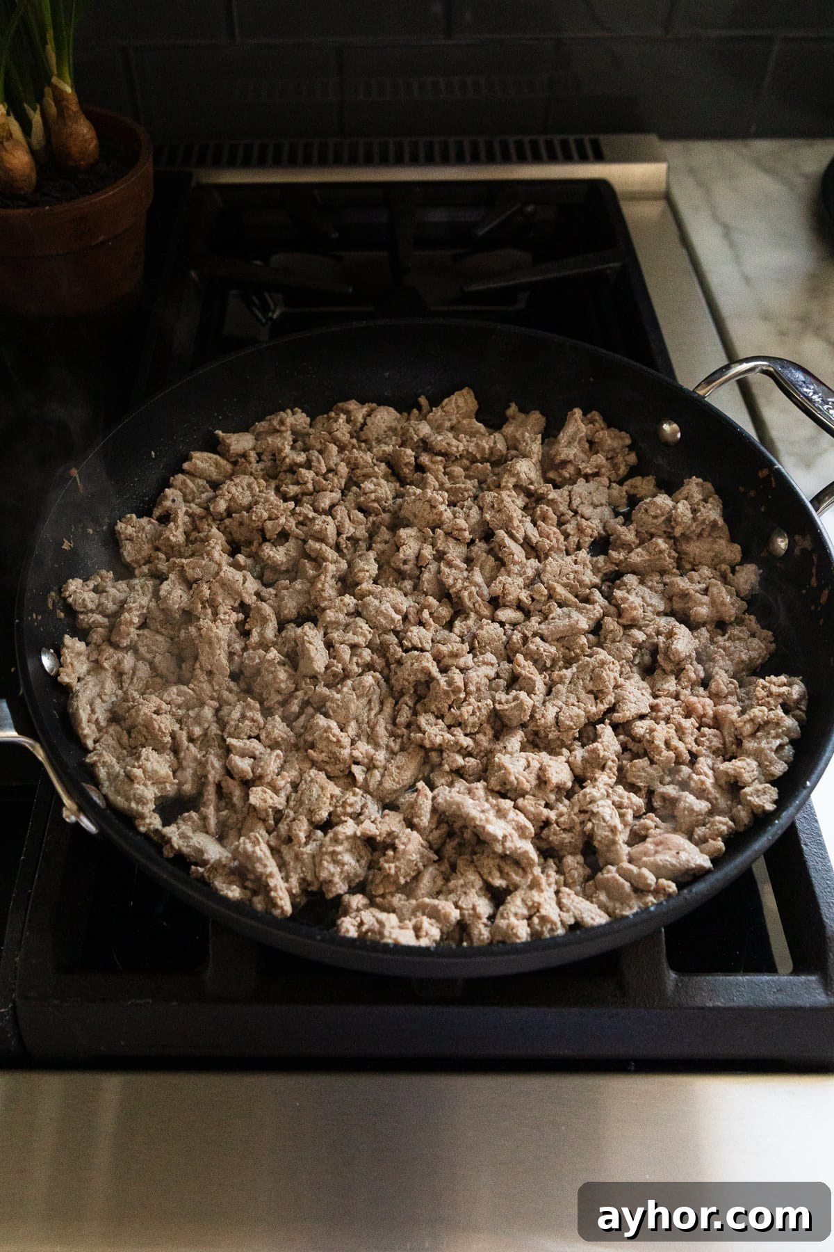 Ground turkey browned in a skillet.