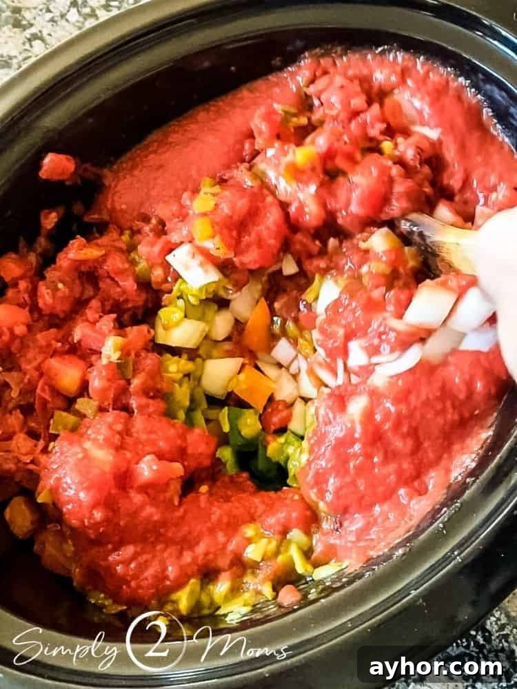 All-Meat Keto Chili Recipe (THM-S Friendly) 6 Overhead view of a crockpot filled with ingredients to make a low carb THM chili without beans